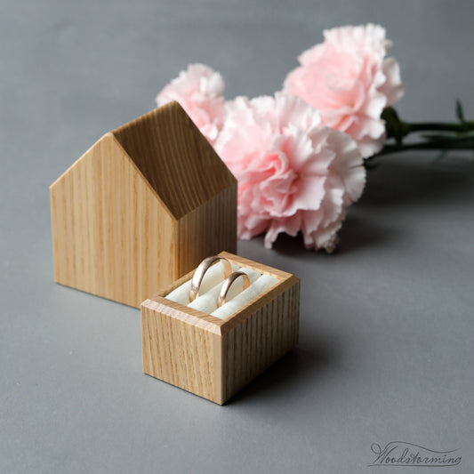 Ash wood house-shaped wedding ring box for two rings.